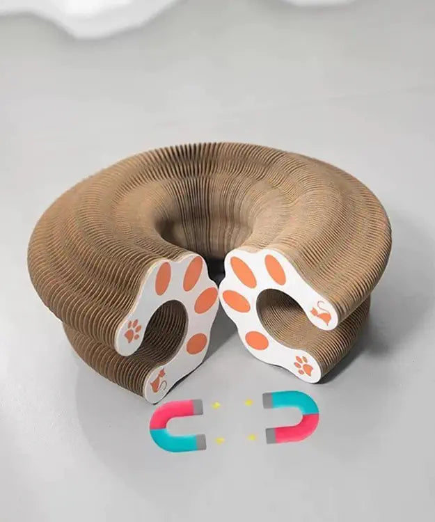Cardboard neck pillow with paw prints on a white background