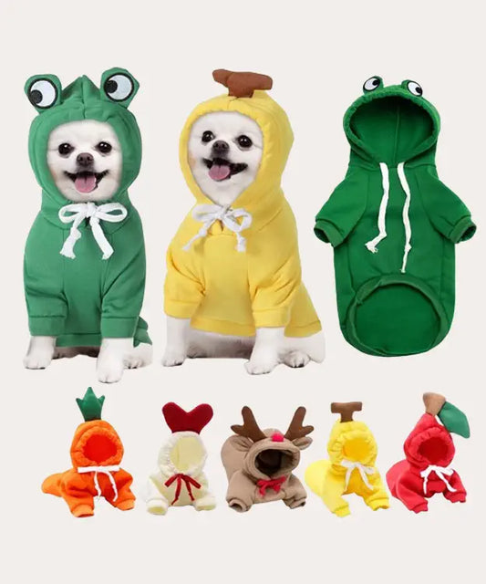 Set of dog costumes including frog, banana, and green onesies on a white background.