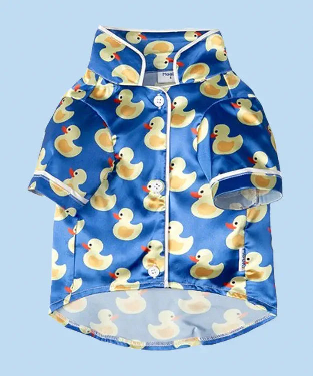 Children's swim shirt with rubber duck pattern on a blue background